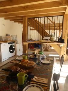 a kitchen with a table with food on it at La Férandie in Chéronnac