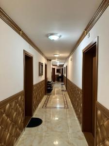 a hallway with doors and a tile floor and a corridorngthngthngthngthngth at Sweet Homes in Sunny Beach