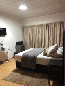 Ένα ή περισσότερα κρεβάτια σε δωμάτιο στο Malebo Guest House