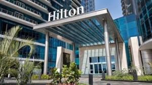 a hotel with a sign on the front of a building at Maadi Urban Apartment in Cairo