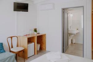 a small room with a desk and a sink at Le Vie di Feronia in Terracina +110 photos