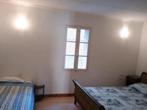 Postel nebo postele na pokoji v ubytování Chambre 2 lits