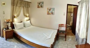 Postel nebo postele na pokoji v ubytování Hotel Anagennisis
