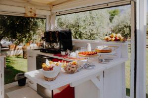 a kitchen with a table with food on it at Le Vie di Feronia in Terracina
