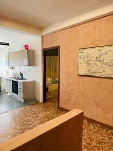 a kitchen with a wall with a map on it at MMM HOME Train Station 1 in Mestre +67 photos