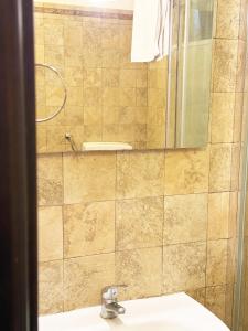 a bathroom with a sink and a shower at Balcone Mediterraneo - Donnalucata & Marina di Ragusa in Ragusa +136 photos