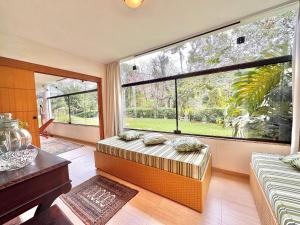 Ένα ή περισσότερα κρεβάτια σε δωμάτιο στο Casa com vista para as montanhas +45 φωτογραφίες