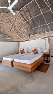 Postel nebo postele na pokoji v ubytování Banja Amani Lodge Mafía Island
