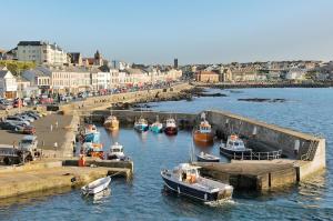 a group of boats are docked in a harbor at Portstewart Escape in Portstewart