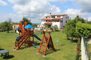 a group of playground equipment in front of a house at Villa Kimberly in Rovinj
