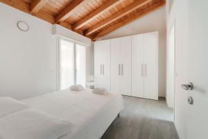 Ένα ή περισσότερα κρεβάτια σε δωμάτιο στο Casa Malù