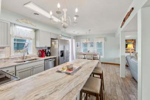 a kitchen with a large wooden counter top in a room at Rose Cottage in Rodanthe