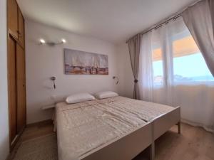 Posteľ alebo postele v izbe v ubytovaní Apartment Ivy