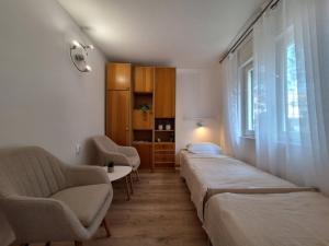 Posteľ alebo postele v izbe v ubytovaní Apartment Ivy