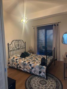 a bedroom with a bed and a window at Nicks sea view appartement II in Petrovac na Moru +26 photos