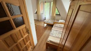 an open door to a room with two beds at Willa Agma in Zakopane
