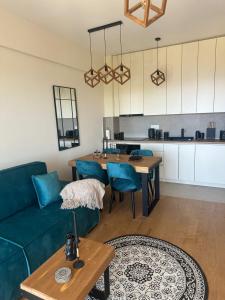 a living room with a couch and a table at Nicks sea view appartement II in Petrovac na Moru