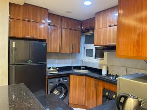 Kuchyň nebo kuchyňský kout v ubytování Dar Residence - Madinaty B12 - U1 - 3 BR - New Cairo + 52 fotografií