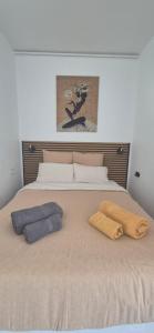 a bedroom with a bed with two pillows on it at Cannes Studio near Croisette Plage in Cannes