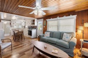 a living room with a couch and a table at Seasons in the Sun in Nags Head