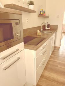 Kuchyňa alebo kuchynka v ubytovaní Trio Apartments