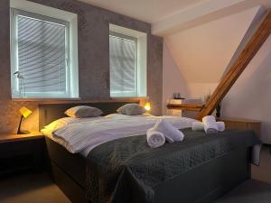 Postel nebo postele na pokoji v ubytování Apartments 23