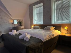 Postel nebo postele na pokoji v ubytování Apartments 23