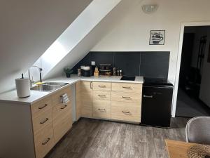 Kuchyň nebo kuchyňský kout v ubytování Apartments 23