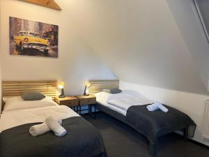 Postel nebo postele na pokoji v ubytování Apartments 23