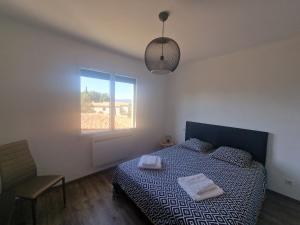 a bedroom with a bed and a window at Elomarisa in Grimaud +12 photos
