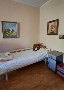 a small bedroom with a bed and a table at Villa Vintage in Tammela +16 photos