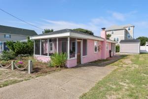 a pink house on the side of a street at The Pink House in Kill Devil Hills