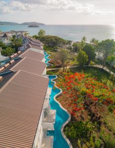 an aerial view of a resort with a river and flowers at Secrets Saint Lucia Resort & Spa - All Inclusive in Gros Islet