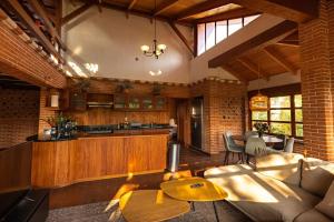a living room with a couch and a table at David's Den Atitlán in Panajachel +16 photos