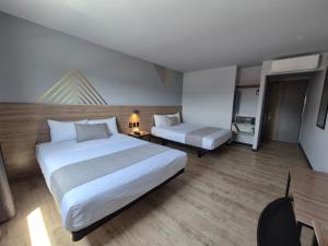 Katil atau katil-katil dalam bilik di Avanta Hotel & Villas Querétaro