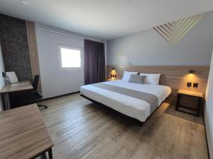Katil atau katil-katil dalam bilik di Avanta Hotel & Villas Querétaro