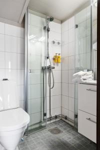 a bathroom with a shower with a toilet and a sink at Trysilfjell 1103, by vacation Trysil in Trysil