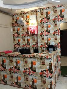 a wall with a bunch of bottles of wine at Hotel Prem Palace in Bhopal