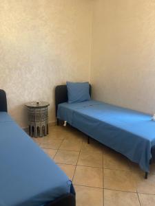 Postel nebo postele na pokoji v ubytování Cabo Negro Beach Climatisé