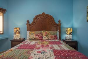 a bedroom with a large bed with two night stands at Happy-N-The-Sun 2 BR Oceanfront in Puerto Peñasco