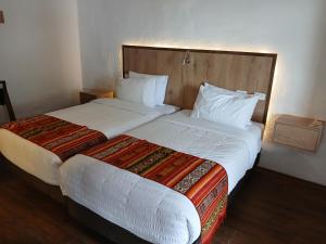 Letto o letti in una camera di Casona Tobar Hotel