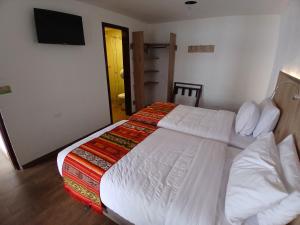 Letto o letti in una camera di Casona Tobar Hotel