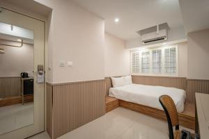 Voodi või voodid majutusasutuse 慶爾喜旅館長沙館Cheers Loft Self Check-in Hotel toas