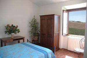 A bed or beds in a room at Agriturismo Pian dei Pini