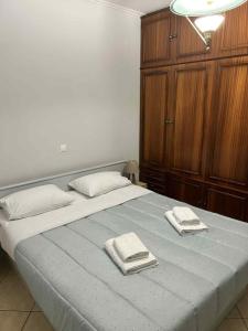 En eller flere senge i et værelse på Olympus Moments