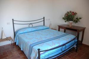 A bed or beds in a room at Agriturismo Pian dei Pini