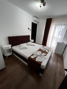 Postel nebo postele na pokoji v ubytování Elegance
