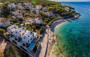 an aerial view of a beach with houses and the ocean at Villa Aster 3 in Sutivan +36 photos