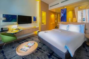 Ένα ή περισσότερα κρεβάτια σε δωμάτιο στο Hotel Rakesh