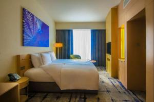Ένα ή περισσότερα κρεβάτια σε δωμάτιο στο Hotel Rakesh